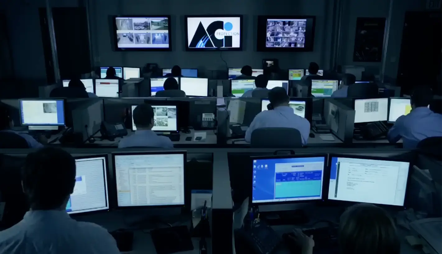 A room full of live operators monitoring security on computer screens